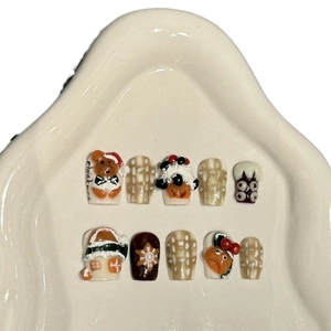 3D Christmas teddy bear handmade press-on nail set featuring reindeer and snowflake patterns