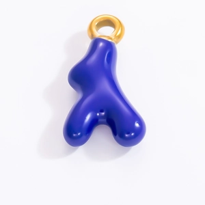 Detailed view of sea star pendant with royal blue enamel and gold-plated metal ring
