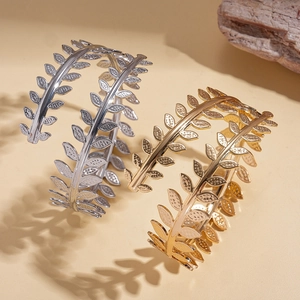 Minimalist gold and silver laurel leaf arm cuffs with detailed nature leaf texture