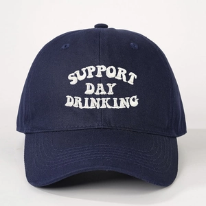 Detailed white embroidery of Support Day Drinking text on navy cotton baseball cap