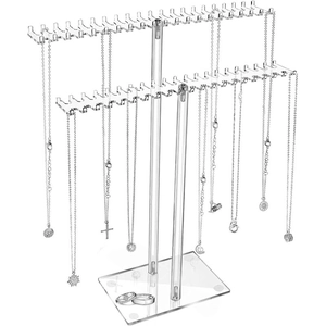 Detail of transparent acrylic jewelry stand showing two tiers for necklaces and bracelets