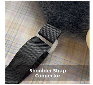Macro detail of plush penguin backpack with nylon strap and transparent adjustment buckle