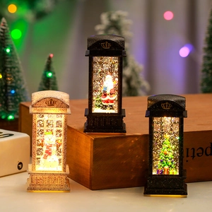 Vintage Christmas lantern snow globe with Santa and snowman scenes in ivory and bronze