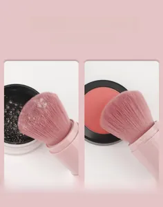Portable pink retractable makeup brush showing soft bristles for powder and blush application