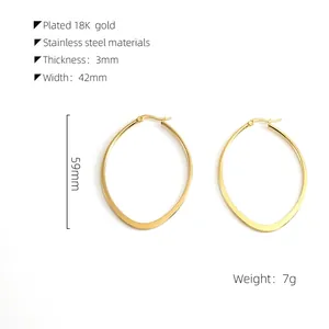 Detail of 18K gold-plated oval hoop earrings with exact width and height specifications