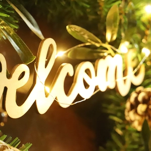 55cm Christmas wreath with pine needles, cones, and lighted wooden Welcome sign decoration