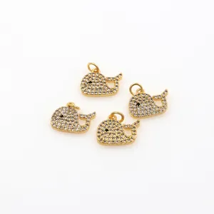 Four gold plated whale charms with micro-paved zircons and ring connectors for DIY jewelry