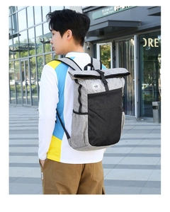 Outdoor waterproof backpack with roll-top closure and grey heathered fabric texture
