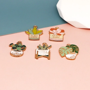 Golden enamel succulent plant pendants featuring Plant Mama and Plant Daddy slogans
