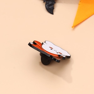 Close-up of Halloween ghost enamel pin with back rubber clutch and smooth metal edges