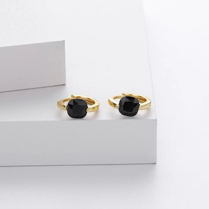 Close-up of S925 silver hoop earrings with square black zircon stones in gold finish