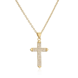 Macro detail of gold-plated cross pendant with micro-pave cubic zirconia on white background