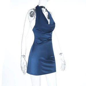 Detailed view of glossy blue satin fabric and cowl neck design on a backless mini dress