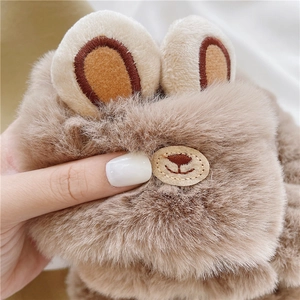 Close-up of soft plush brown and beige animal ear headbands with high quality fur texture