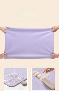 Detail showing the purple silicone baking mat with measurement scales and high flexibility