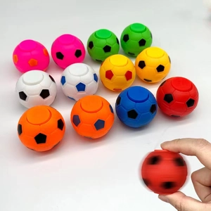 Colorful football-shaped fidget spinners for children in multiple vibrant plastic colors