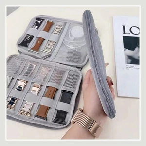 Gray fabric organizer bag for Apple Watch straps with elastic loops and mesh pocket