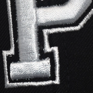 Close-up of white 3D embroidery letter P on black twill mesh baseball cap fabric
