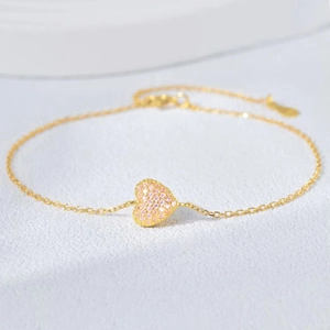 Elegant S925 sterling silver heart bracelet with pink zircon stone on a gold chain