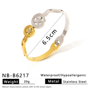Close-up of dual-tone stainless steel star bracelet with diamond inlay and clasp detail
