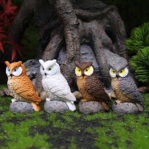Set of four lifelike resin owl figurines on rock bases for garden micro landscape decor