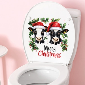 Close-up of Christmas cow toilet seat sticker with Merry Christmas text and holly leaves