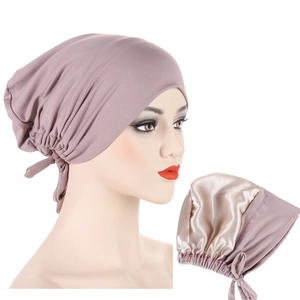 Detail of satin-lined sleep bonnet in lotus pink with silk-like interior for hair care