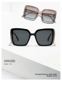 Detail of square sunglasses with metal temple accents on a minimalist display stand