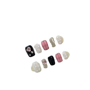 Y2K sweet cool press-on nail kit with pink hearts, black plaid, and pearl accents