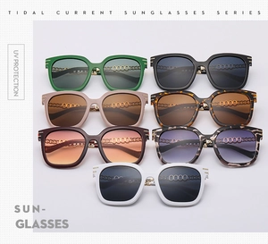 Flat lay of oversized sunglasses in seven colors with high-quality metal chain temples