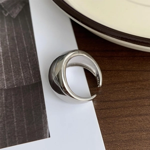 Macro shot of minimalist 925 sterling silver open ring with S925 hallmark engraving
