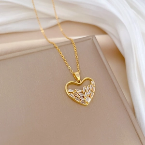 Titanium steel heart necklace featuring sparkling cubic zirconia on a beige jewelry box