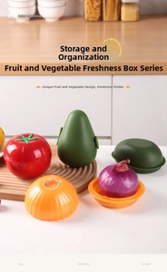 Detail view of tomato, avocado and onion shaped plastic food storage crisper boxes