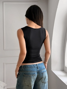 Back view of black ribbed Y2K sleeveless vest showing the slim fit knit fabric design