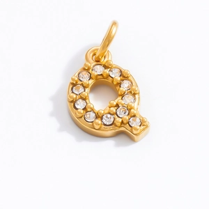 Close-up of 18K gold plated letter Q pendant with sparkling cubic zirconia stones
