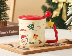 Detail of Christmas ceramic mug with red lid and star handle spoon in festive setting