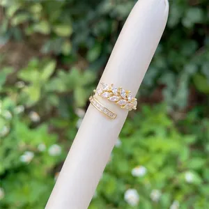Detail of 18K gold wheat-shaped ring with marquise and baguette zircon stones