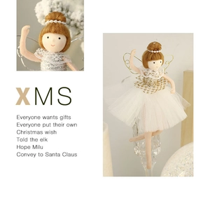 Detail showing plush ballet angel doll with white tutu and gold sequins on Christmas tree