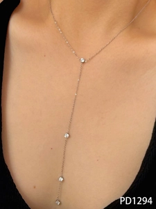 Detail of elegant Y-shaped drop necklace with zircon stones on silver-tone chain