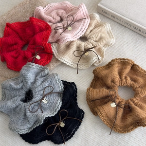 Set of six soft knitted scrunchies with lace trim and bow details in various colors