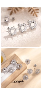 Macro detail of silver snowflake earring settings with white zircon inlay for DIY jewelry