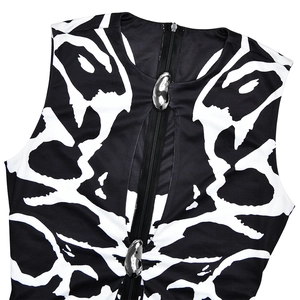 Close-up of leopard print neckline featuring a black zipper with silver metallic details