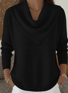 Detail of elegant black knit sweater featuring a stylish draped V-neck and soft texture