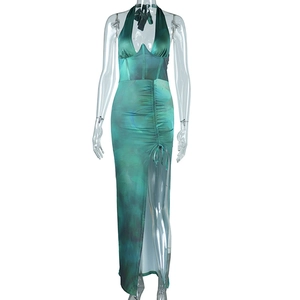 Detail view of the green marble print dress with side drawstring and high leg slit