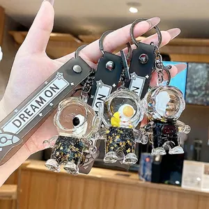 Astronaut liquid quicksand keychain with stars and Dream On strap for bags and keys