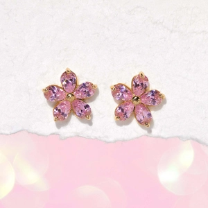 Macro detail of elegant pink zircon flower earrings with gold plating and S925 silver pins
