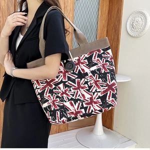 Close-up of canvas tote bag showing thick texture and artistic British cross pattern print
