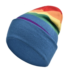 Detailed close-up of rainbow striped knit beanie with vibrant multicolor pattern and texture