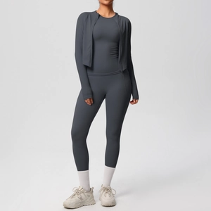 Close-up of charcoal grey yoga set featuring high-waisted leggings and zip-up jacket