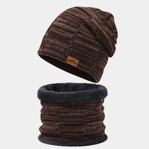 Detail of winter knitted hat and neck warmer with thick faux fur lining and leather patch